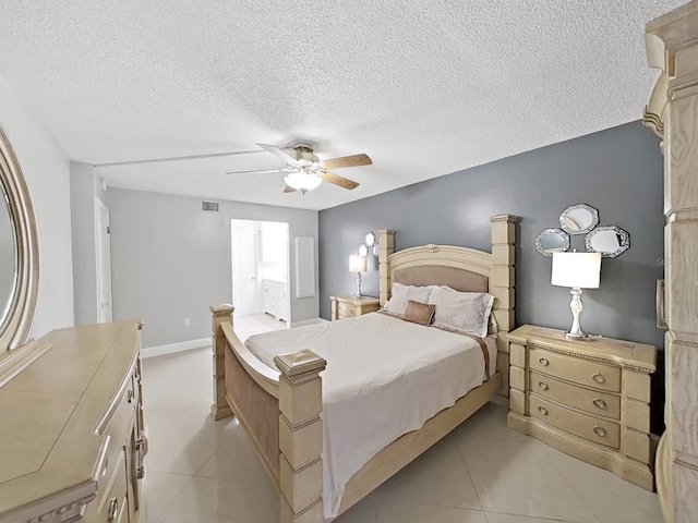 bedroom with light tile patterned floors, a textured ceiling, and ceiling fan