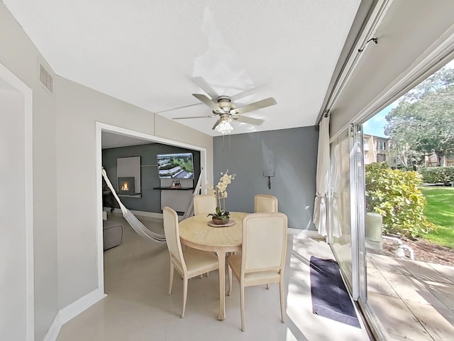 dining space featuring ceiling fan