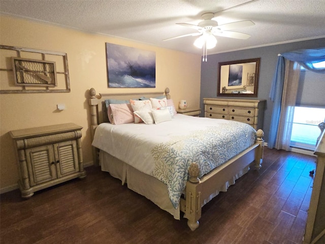 bedroom featuring ceiling fan, dark wood-type flooring, a textured ceiling, and ornamental molding