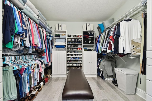 spacious closet featuring light wood-type flooring