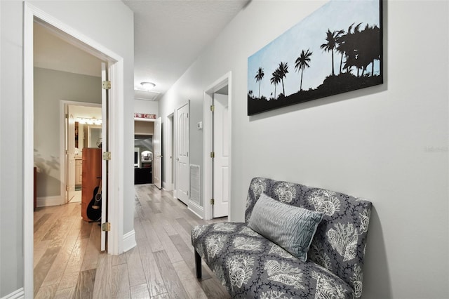 living area with light hardwood / wood-style flooring