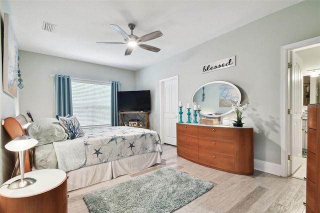 bedroom with light hardwood / wood-style floors and ceiling fan