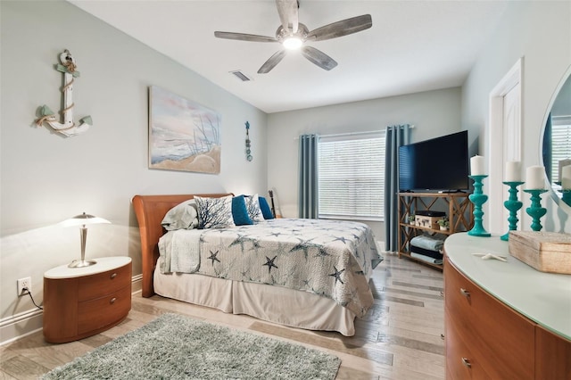 bedroom with ceiling fan and light hardwood / wood-style flooring