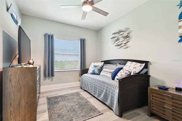 bedroom with light wood-type flooring and ceiling fan