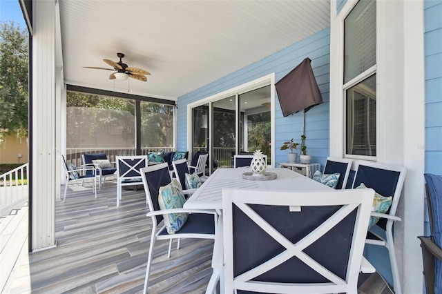 sunroom / solarium with ceiling fan