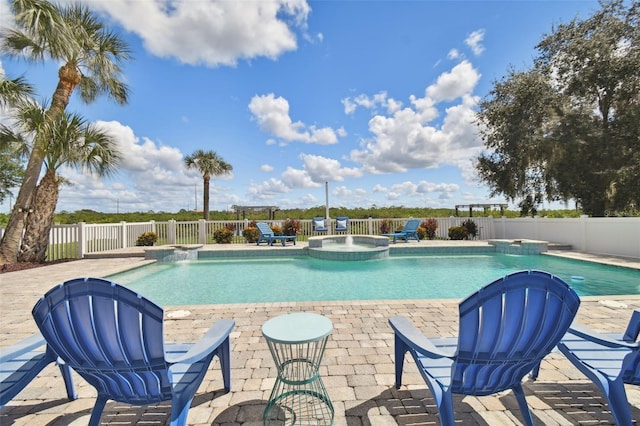 view of swimming pool featuring a patio, an in ground hot tub, and pool water feature