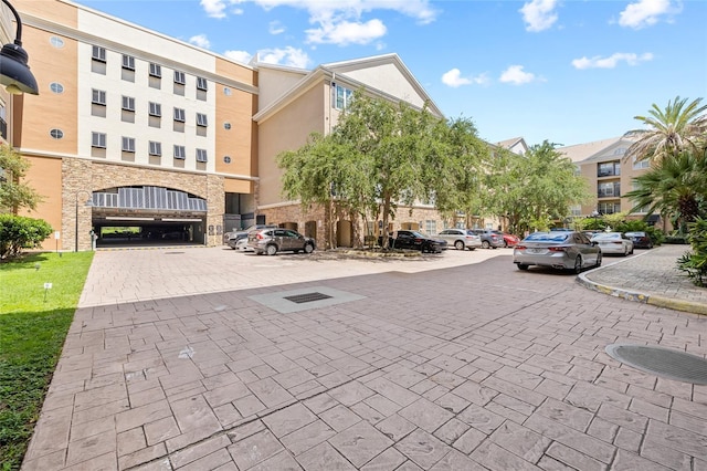 4221 W Spruce St Unit 1424, Tampa, FL 33607 - view of building exterior with uncovered parking