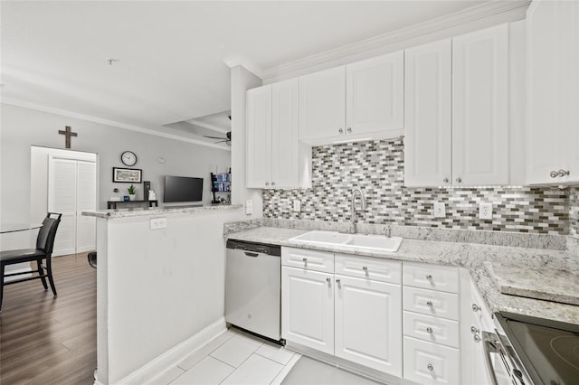 kitchen with white cabinetry, kitchen peninsula, stainless steel appliances, ceiling fan, and sink