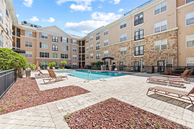 view of pool featuring a patio