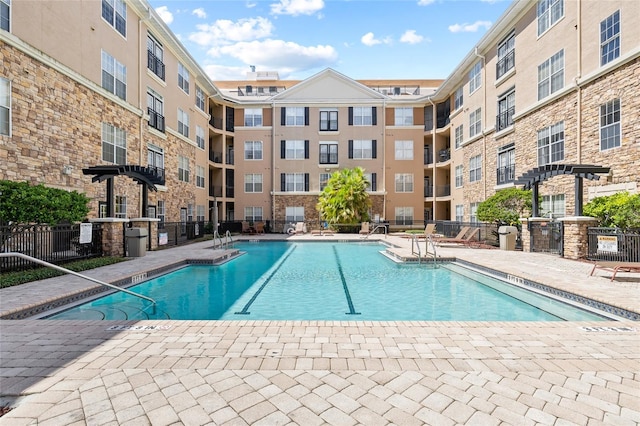 view of swimming pool with a patio area