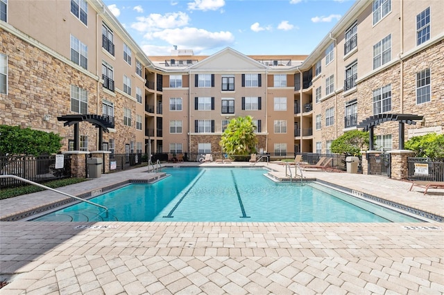 4221 W Spruce St Unit 1424, Tampa, FL 33607 - community pool featuring a patio area