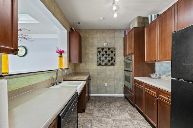 4221 W Spruce St Unit 1424, Tampa, FL 33607 - kitchen with black appliances, a sink, and light countertops