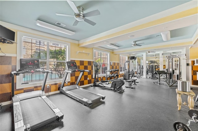 gym featuring ceiling fan and a wealth of natural light