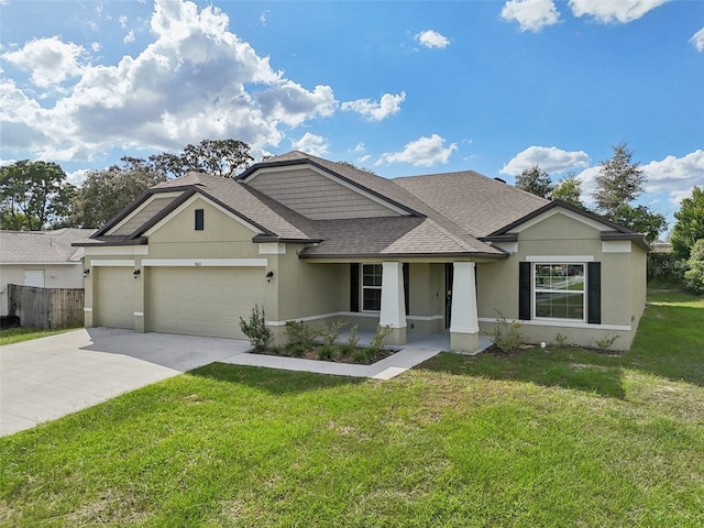 view of front of property with a garage and a front yard