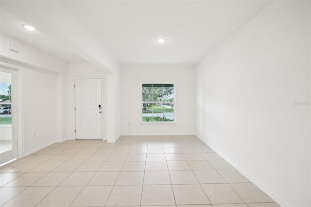 unfurnished room with light tile patterned floors