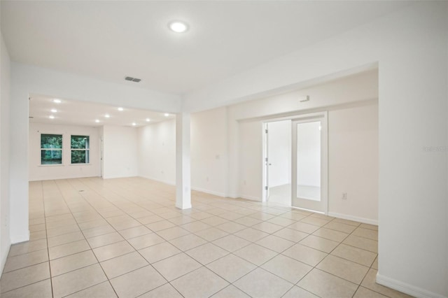 spare room with light tile patterned floors