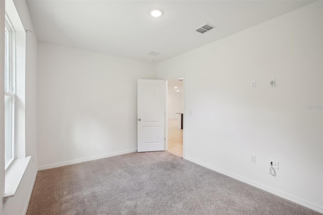 view of carpeted spare room