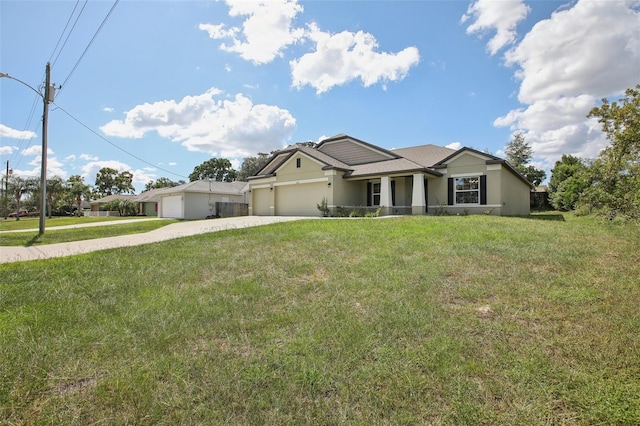 view of front of property with a garage and a front yard