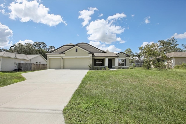 view of front of property with a garage and a front yard