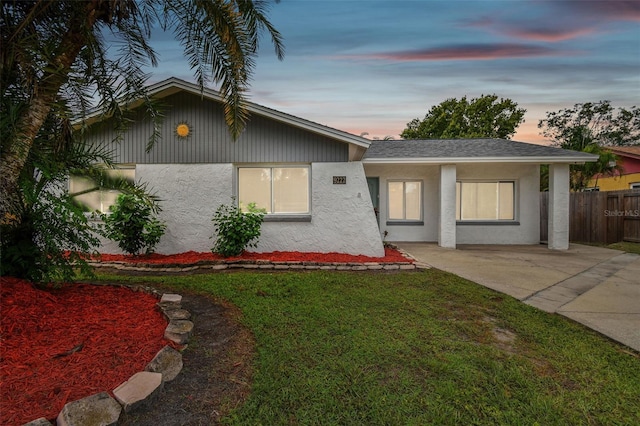 view of front of property with a yard