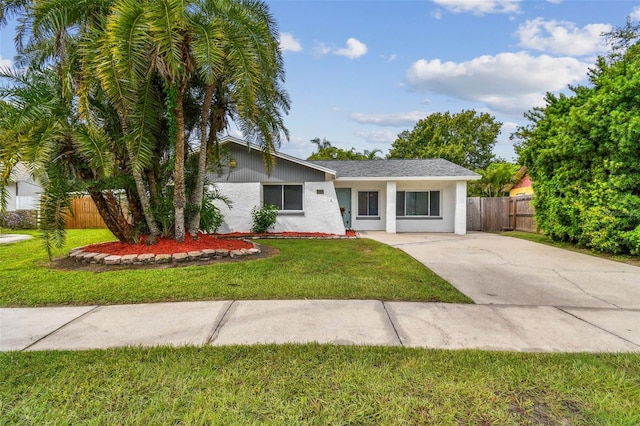 ranch-style home with a front yard