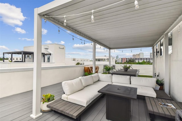 wooden terrace featuring outdoor lounge area