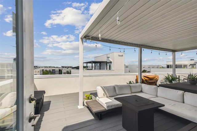 wooden terrace featuring an outdoor living space