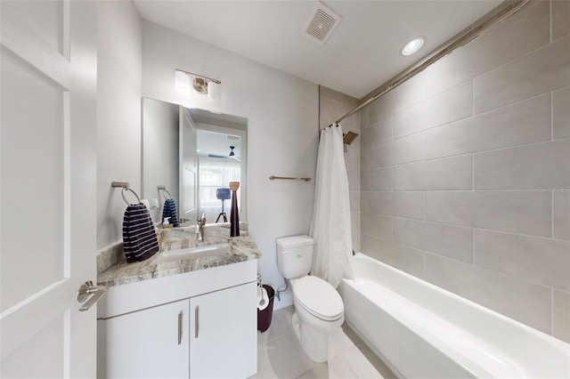 full bathroom featuring tile patterned flooring, vanity, toilet, and shower / bathtub combination with curtain