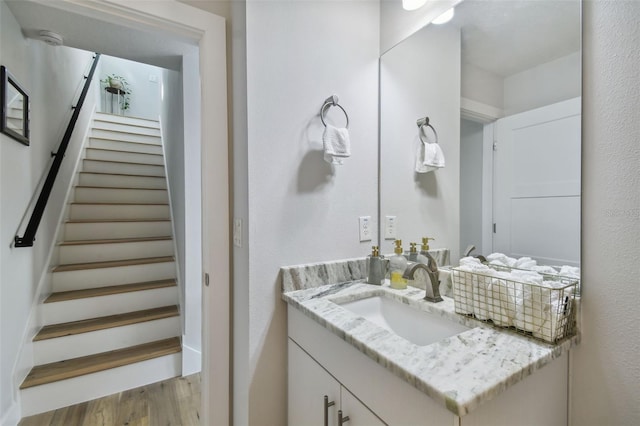 bathroom featuring hardwood / wood-style flooring and vanity