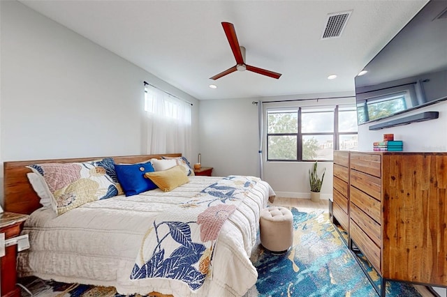 bedroom featuring ceiling fan and hardwood / wood-style flooring