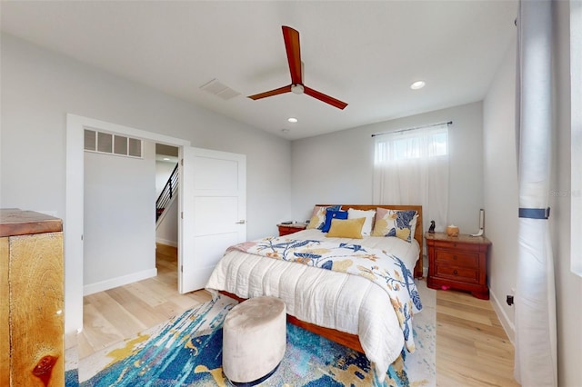 bedroom featuring ceiling fan and light hardwood / wood-style floors