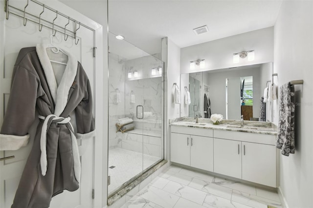 bathroom featuring vanity and an enclosed shower