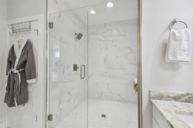 bathroom with vanity and an enclosed shower