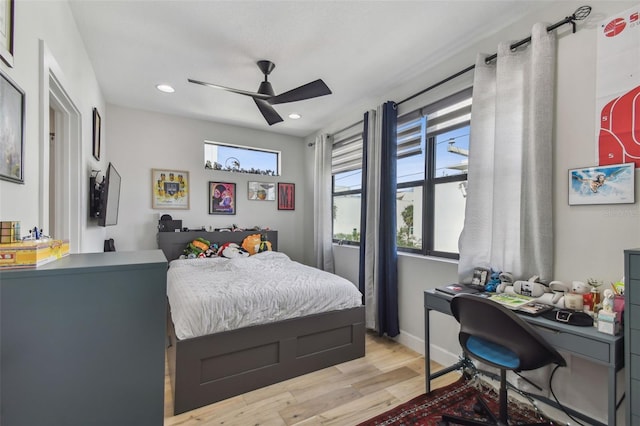 bedroom with ceiling fan and light hardwood / wood-style floors