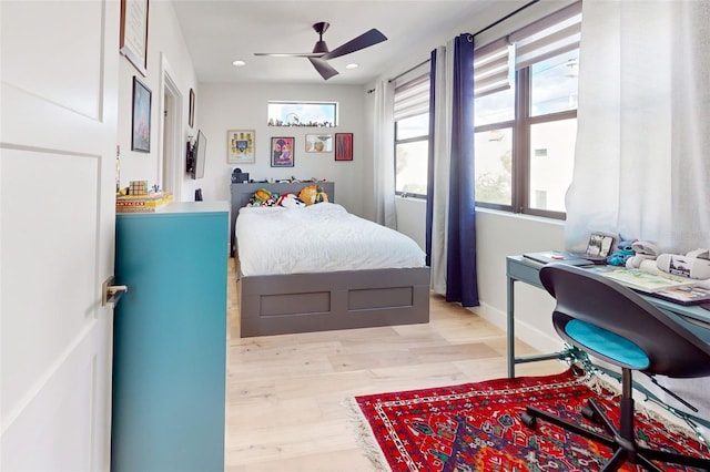 bedroom with light wood-type flooring and ceiling fan