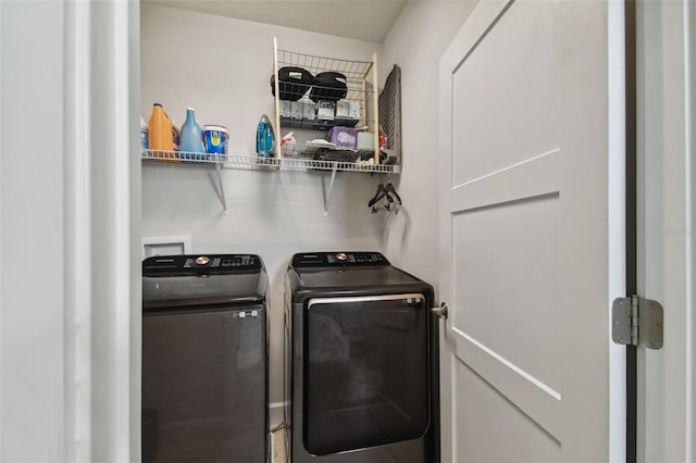 laundry room with washer and clothes dryer