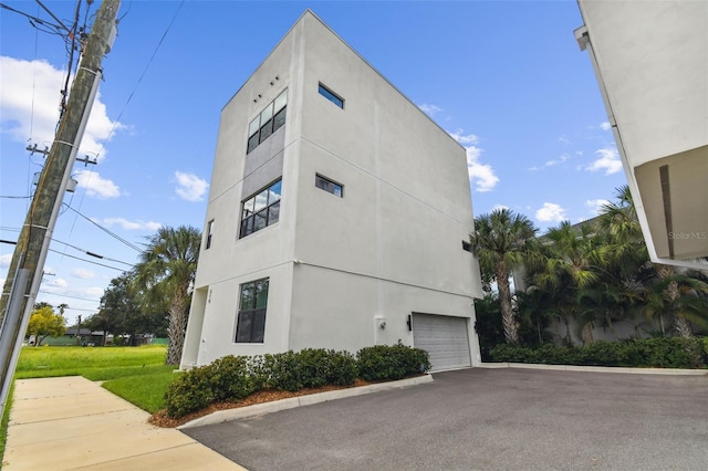 view of side of property featuring a garage