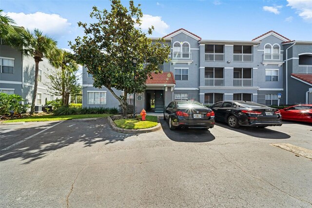 18001 Richmond Place Dr Unit 511, Tampa, FL 33647 - view of property with uncovered parking