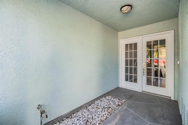 property entrance featuring french doors