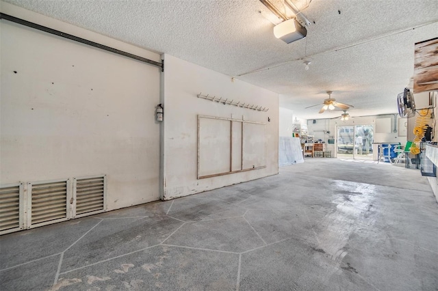 garage featuring a garage door opener and ceiling fan