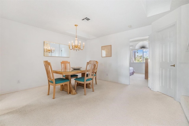 dining room featuring light carpet and visible vents