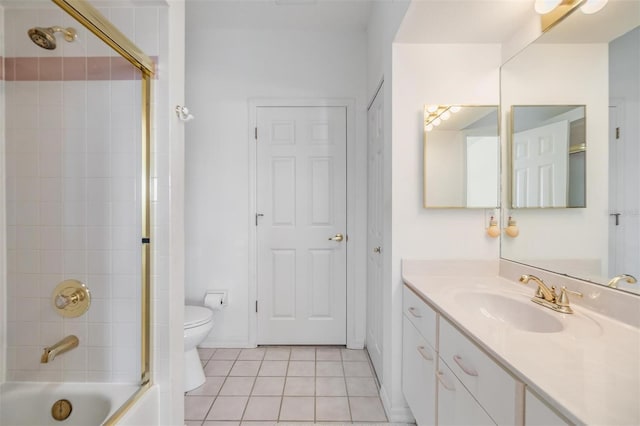 full bath featuring toilet, tub / shower combination, tile patterned flooring, and vanity