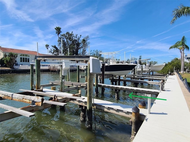 dock area featuring a water view and boat lift