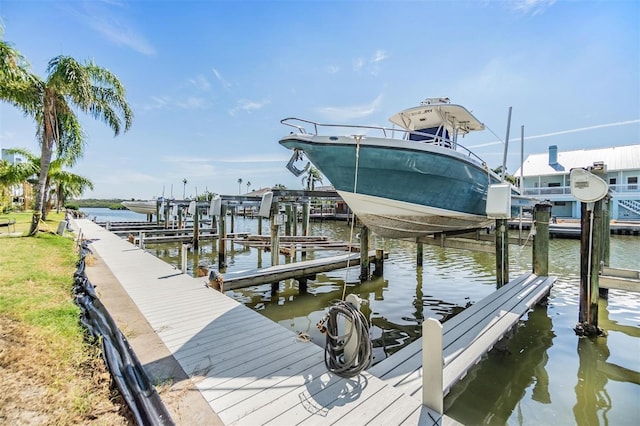 view of dock with a water view and boat lift