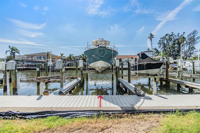 dock area featuring a water view and boat lift