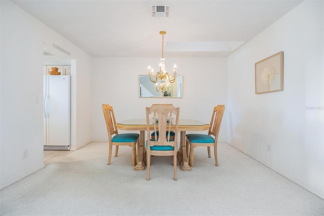 dining space featuring light carpet, visible vents, and an inviting chandelier