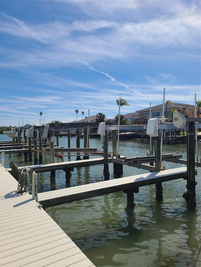 dock area with a water view and boat lift