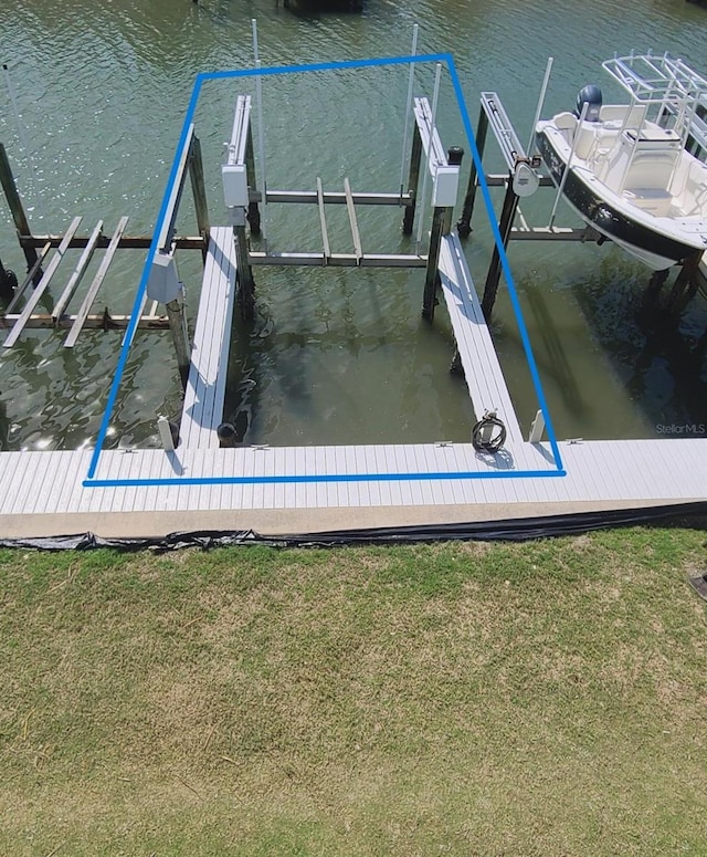 exterior space with a water view and boat lift