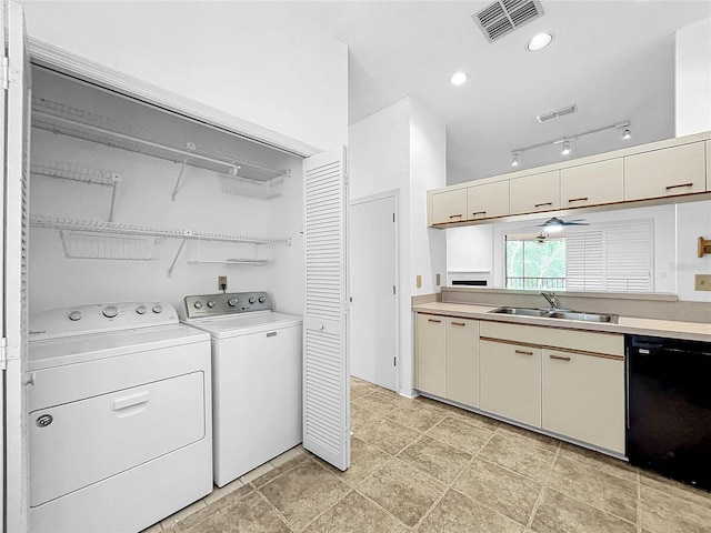 laundry room with sink and washer and dryer