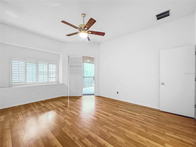 unfurnished room featuring ceiling fan, a textured ceiling, and light hardwood / wood-style floors